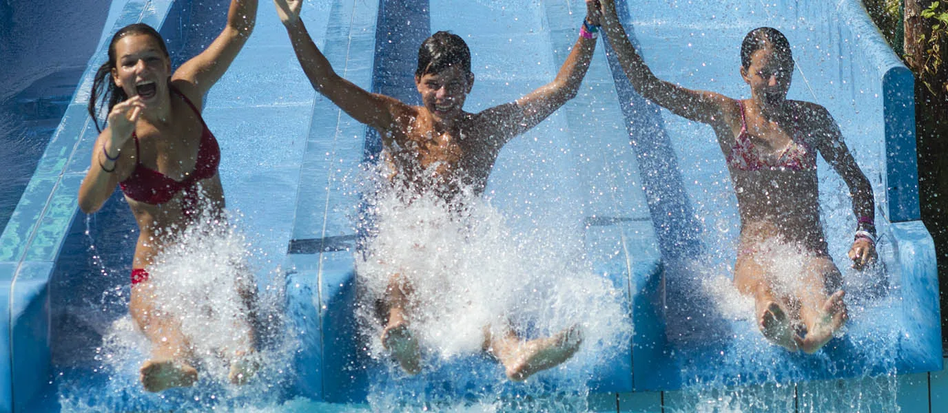 Friends on a resort water slide